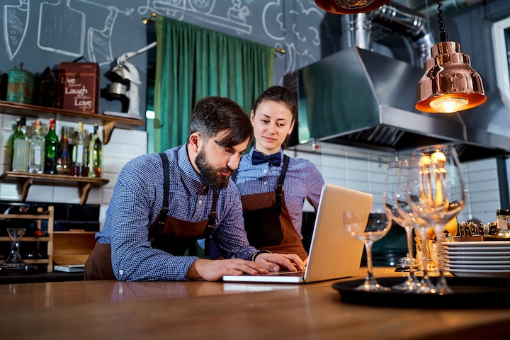 An employee adds restaurant photography to their online presence.